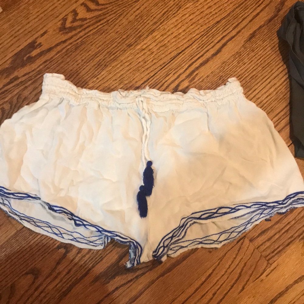 White shorts with blue embroidery